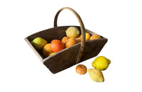 Antique wooden harvest panier filled with marble trompe l'oeil lemons, limes, oranges and mandarins.Italian