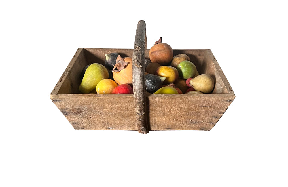 Wooden harvest panier, filled with a large collection of assorted Italian marble and alabaster fruit