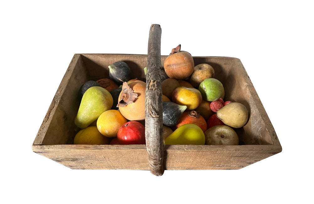 Wooden harvest panier, filled with a large collection of assorted Italian marble and alabaster fruit