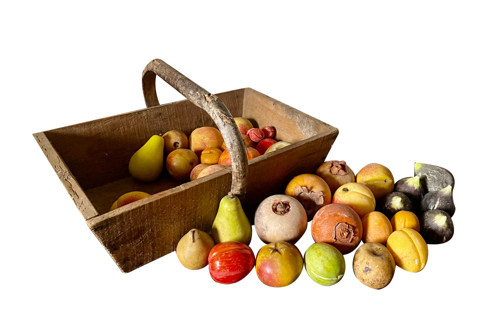 Wooden harvest panier, filled with a large collection of assorted Italian marble and alabaster fruit
