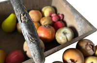 Wooden harvest panier, filled with a large collection of assorted Italian marble and alabaster fruit
