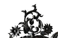 Pretty wrought iron mirror with floral and foliate decoration circa 1900