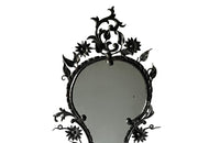 Pretty wrought iron mirror with floral and foliate decoration circa 1900