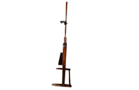 Charming rustic easel with sliding height adjustable shelf .