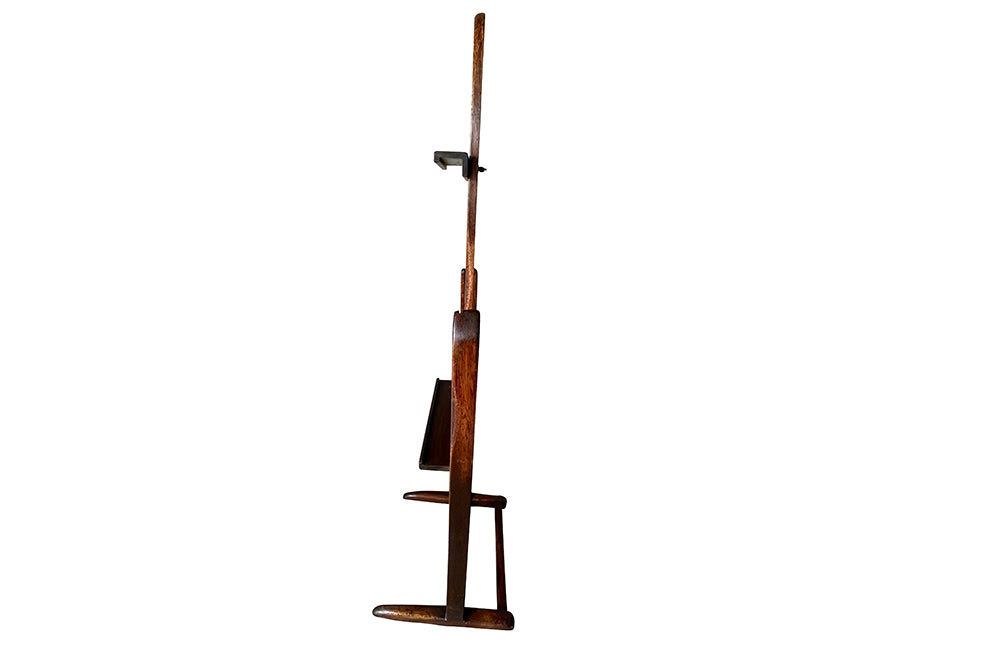 Charming rustic easel with sliding height adjustable shelf .