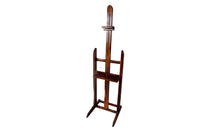 Charming rustic easel with sliding height adjustable shelf .
