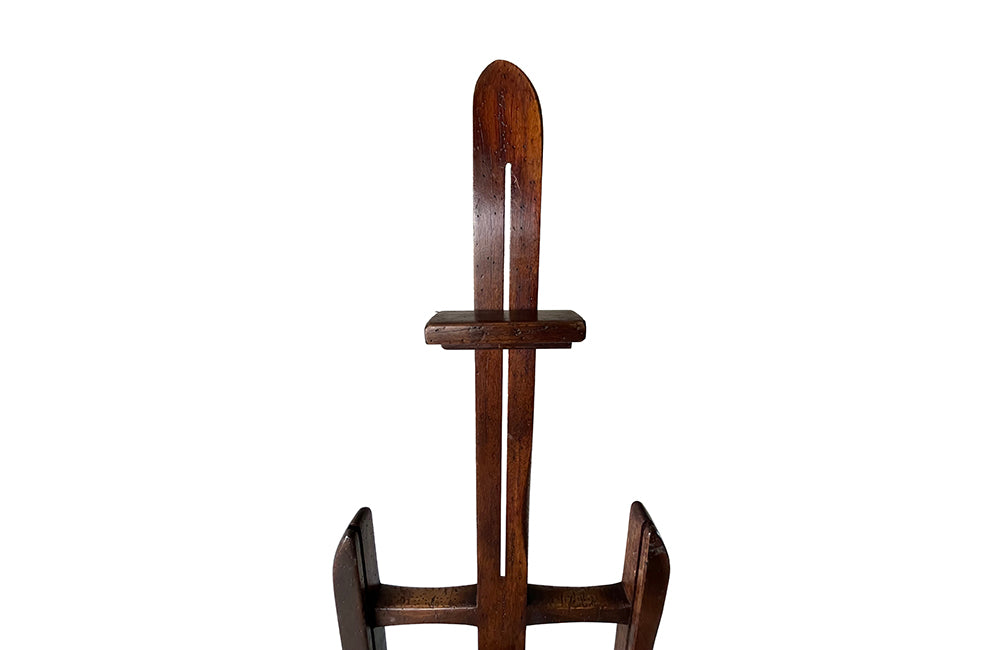 Charming rustic easel with sliding height adjustable shelf .