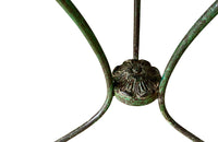 French green iron gueridon with lovely scrolled wrought iron legs and pretty cast iron central floral medallion. Remains of its original layers of paint.