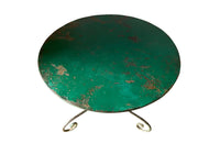 French green iron gueridon with lovely scrolled wrought iron legs and pretty cast iron central floral medallion. Remains of its original layers of paint.