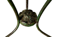 French green iron gueridon with lovely scrolled wrought iron legs and pretty cast iron central floral medallion. Remains of its original layers of paint.