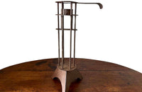 Large iron candle holder in the form of a French 'Rat de Cave' or cellar candlestick.