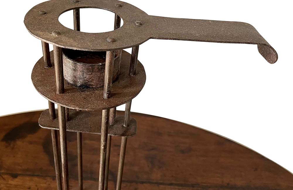 Large iron candle holder in the form of a French 'Rat de Cave' or cellar candlestick.