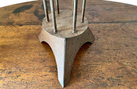 Large iron candle holder in the form of a French 'Rat de Cave' or cellar candlestick.
