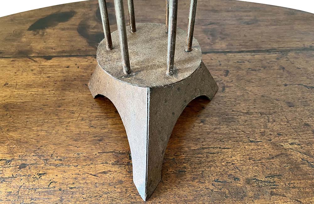 Large iron candle holder in the form of a French 'Rat de Cave' or cellar candlestick.