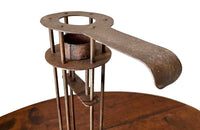 Large iron candle holder in the form of a French 'Rat de Cave' or cellar candlestick.