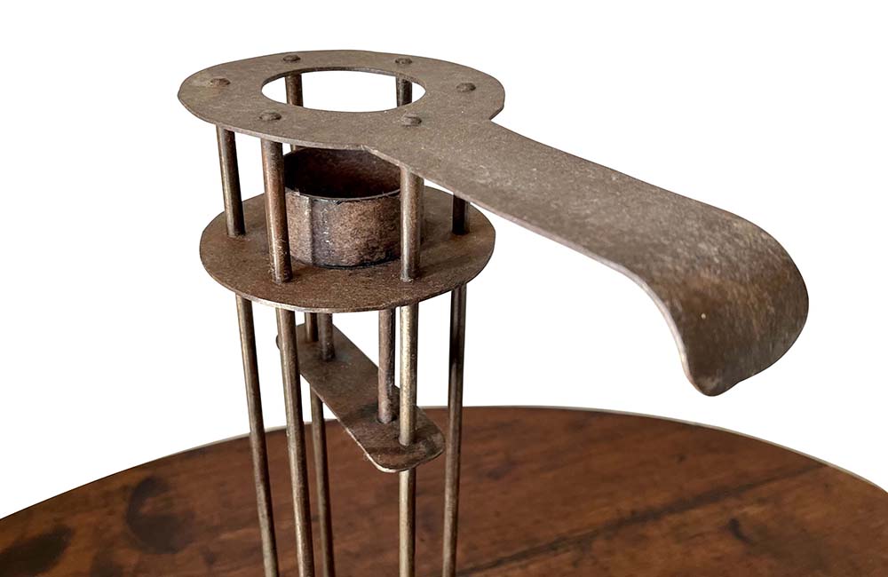 Large iron candle holder in the form of a French 'Rat de Cave' or cellar candlestick.