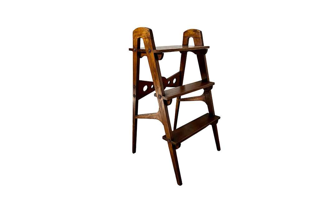 Set of oak three tiered library steps. These stylish French steps feature a geometric design and elegant tapered legs. Circa 1930