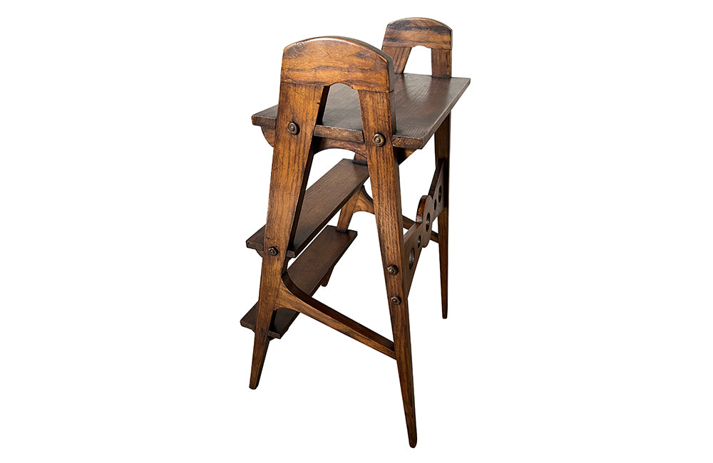 Set of oak three tiered library steps. These stylish French steps feature a geometric design and elegant tapered legs. Circa 1930