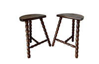 Pair of vintage demi lune tripod stools with bobbin carved legs.