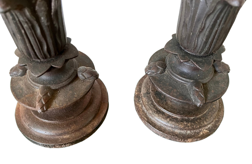 Pair of 19th century French cast iron vases in tulip form with ivy and foliate decoration to both sides. Stamped Bussy.