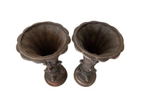 Pair of 19th century French cast iron vases in tulip form with ivy and foliate decoration to both sides. Stamped Bussy.