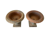 Pair of pretty French cast iron medici garden urns in the Neo-Classical style with traces of original blue paint. Circa 1930