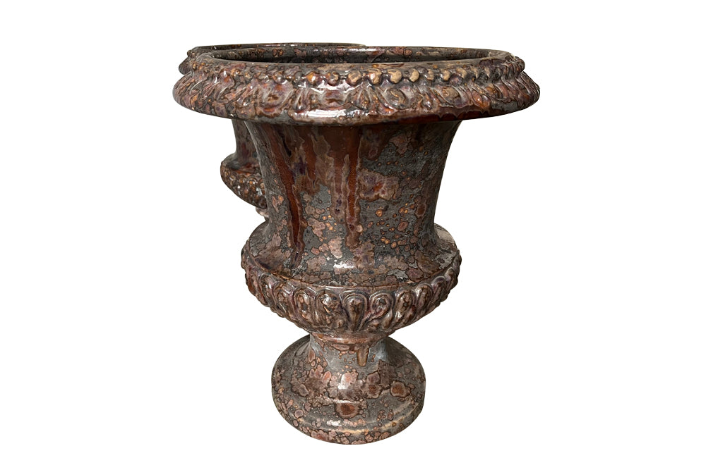 pair of beautiful French Medici terracotta urns in a faux marble glazed finish.