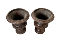 pair of beautiful French Medici terracotta urns in a faux marble glazed finish.