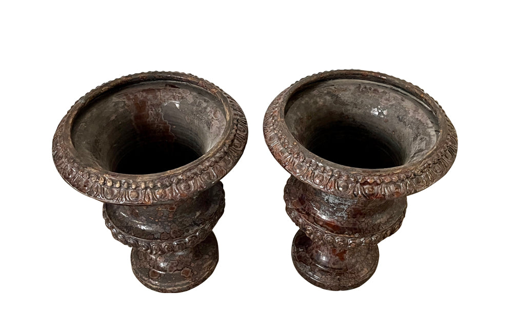 pair of beautiful French Medici terracotta urns in a faux marble glazed finish. 