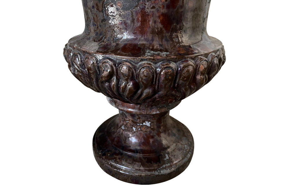 pair of beautiful French Medici terracotta urns in a faux marble glazed finish.
