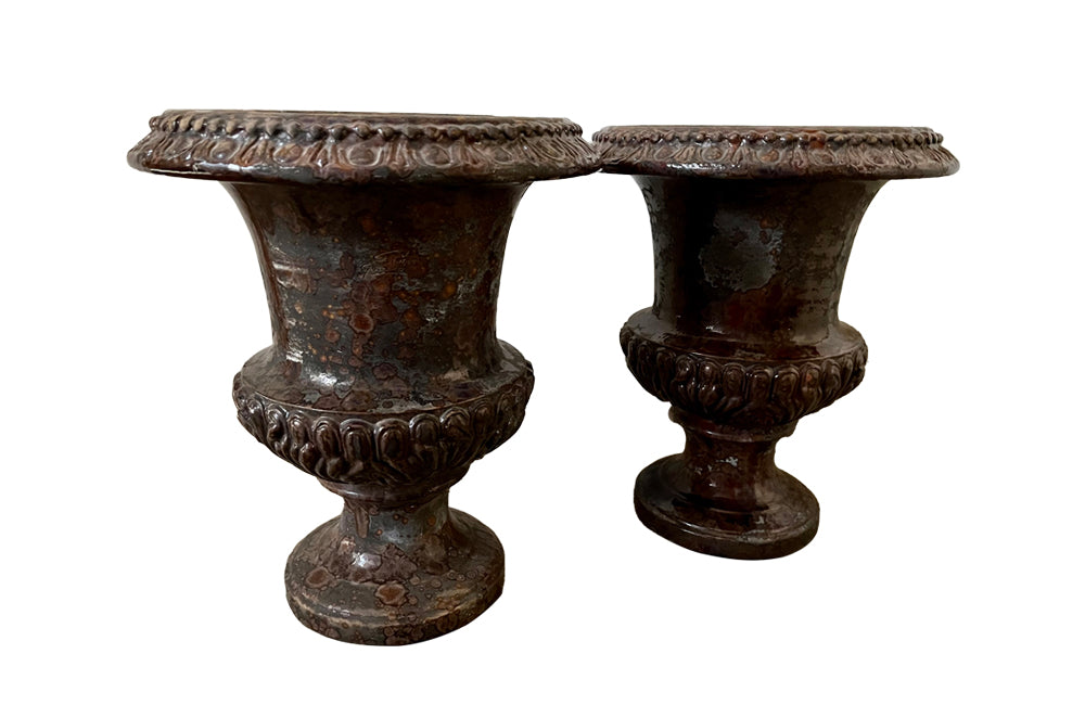 pair of beautiful French Medici terracotta urns in a faux marble glazed finish. 