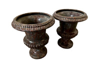 pair of beautiful French Medici terracotta urns in a faux marble glazed finish. 