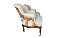 Elegant pair of walnut French armchairs in the Louis XV style.