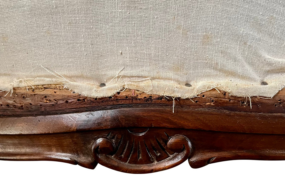 Elegant pair of walnut French armchairs in the Louis XV style.