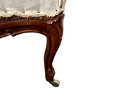 Elegant pair of walnut French armchairs in the Louis XV style.