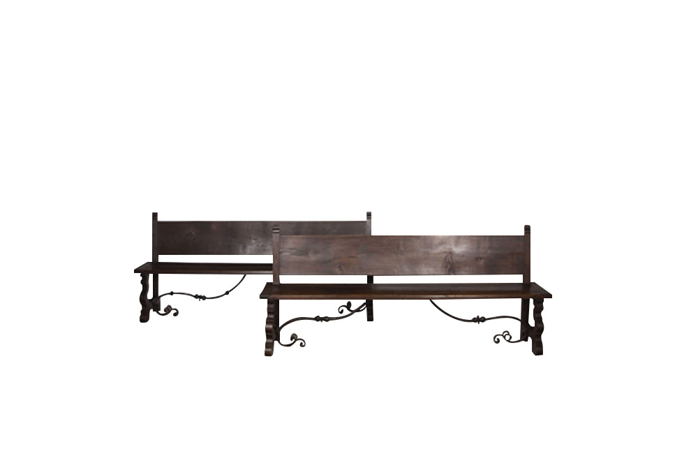 Pair of large Spanish oak benches with backs. Carved legs and decorative wrought iron stretchers.