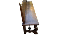 Pair of large Spanish oak benches with backs. Carved legs and decorative wrought iron stretchers.