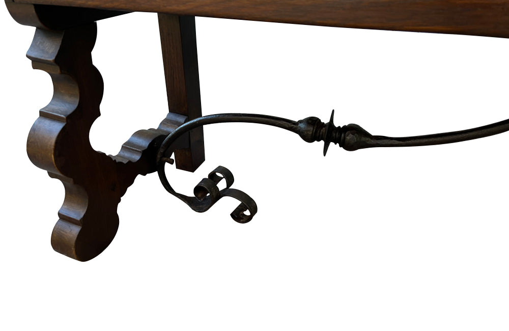 Pair of large Spanish oak benches with backs. Carved legs and decorative wrought iron stretchers.