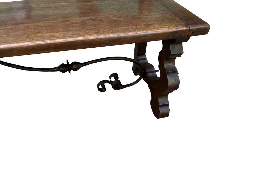 Pair of large Spanish oak benches with backs. Carved legs and decorative wrought iron stretchers.