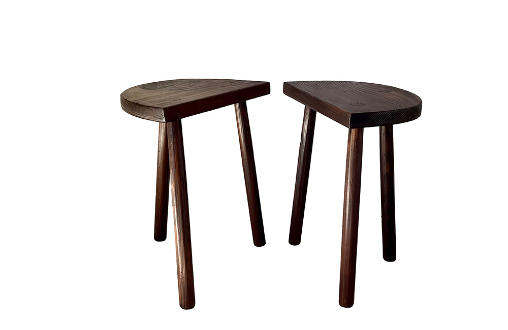 Pair of vintage demi lune tripod stools.