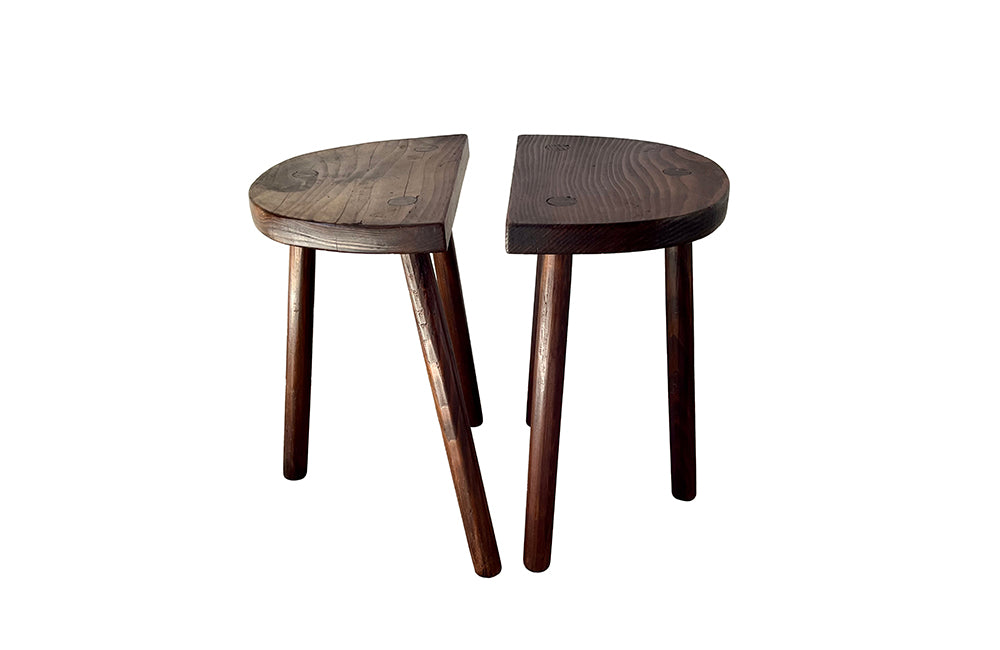 Pair of vintage demi lune tripod stools.