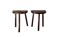 Pair of vintage demi lune tripod stools.