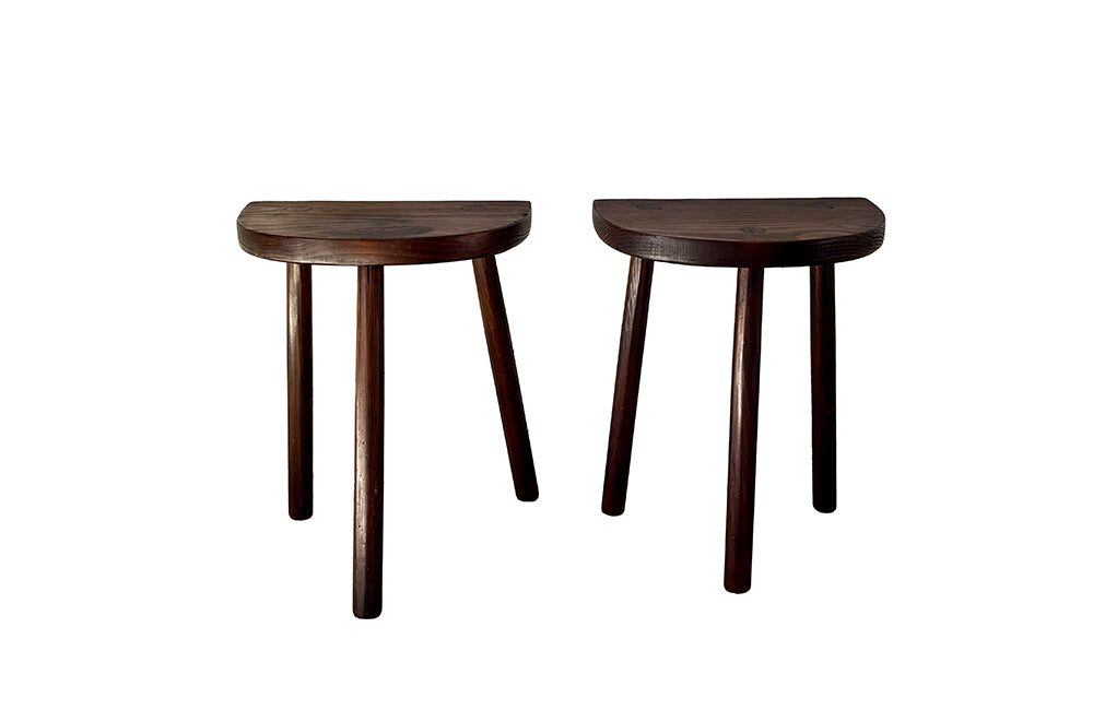Pair of vintage demi lune tripod stools.