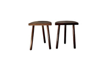 Pair of vintage demi lune tripod stools.