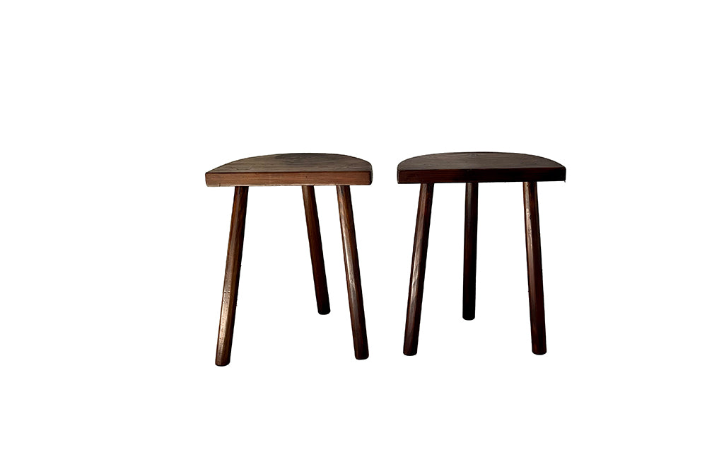 Pair of vintage demi lune tripod stools.