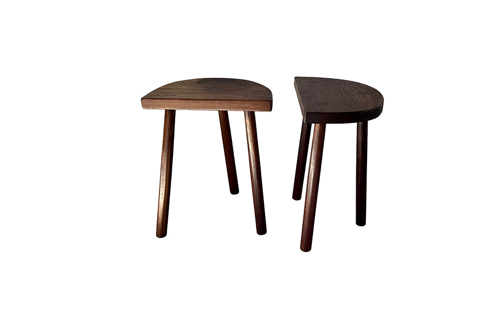 Pair of vintage demi lune tripod stools.