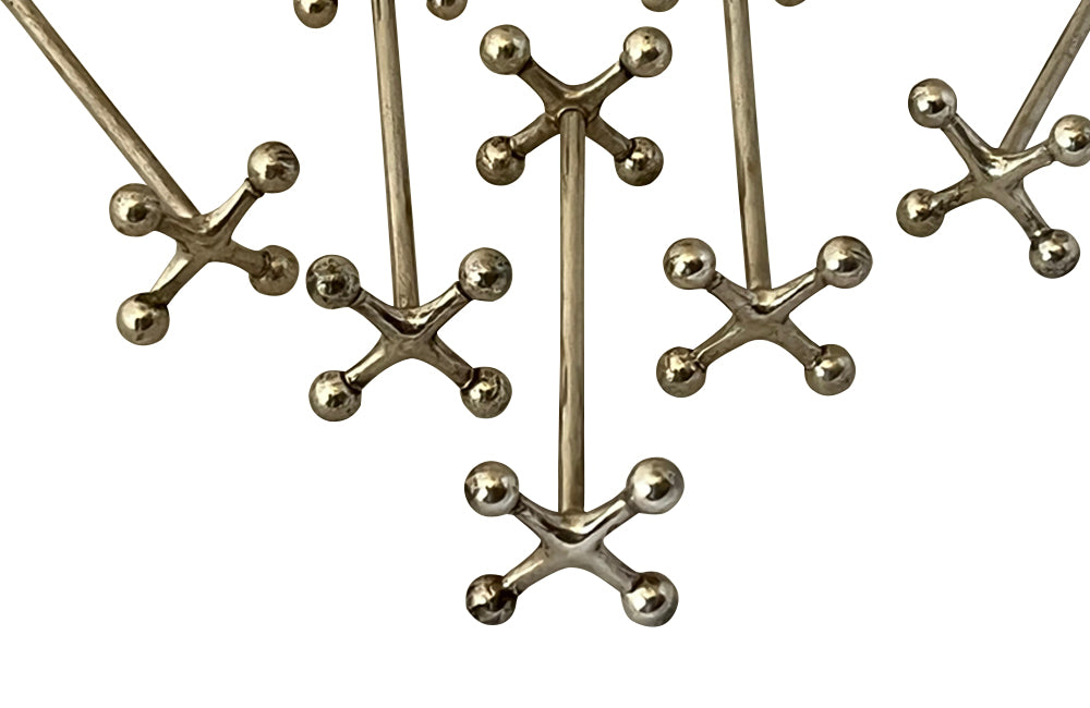 Stylish set of twelve art deco silverplate cutlery rests of simple and elegant design.