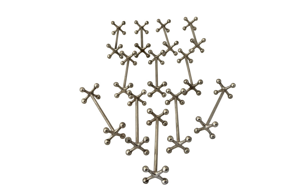 Stylish set of twelve art deco silverplate cutlery rests of simple and elegant design.