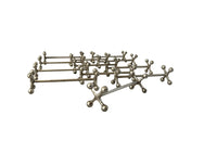 Stylish set of twelve art deco silverplate cutlery rests of simple and elegant design.