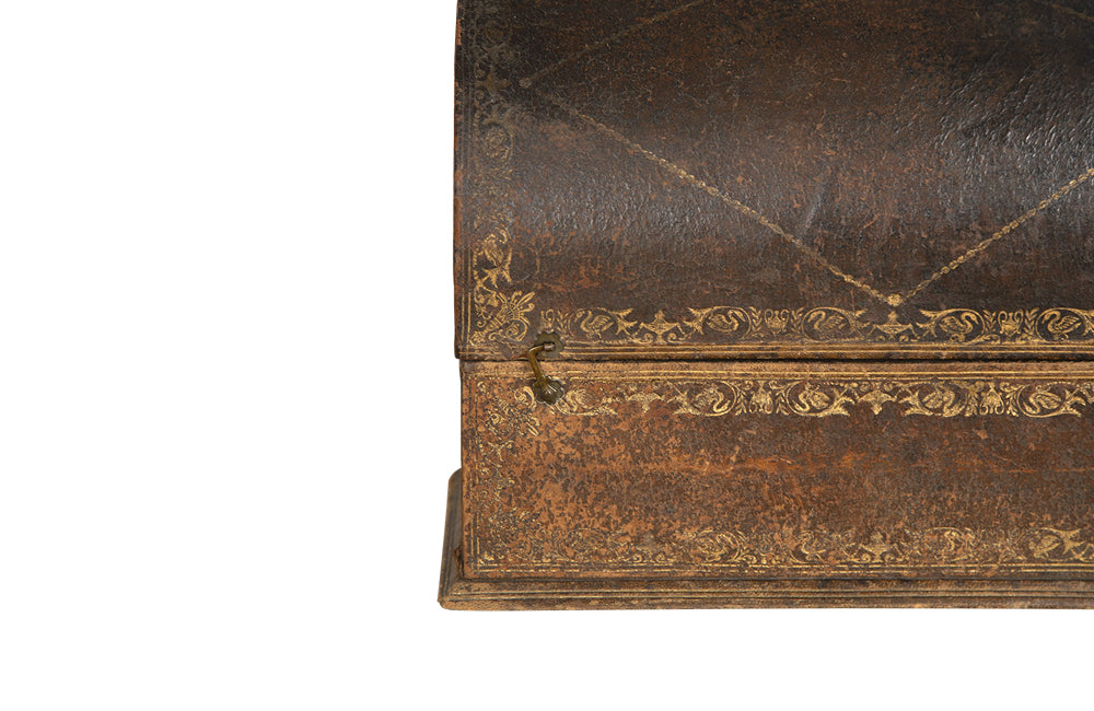 Charming French lidded file box in lovely old worn leather with Neo-Classical embossed motifs, including swans and urns . The base bears the original retail label of Au Bon Marche.